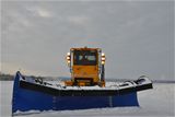 Derek Harlow plows the snow from the airfield for Base Operations. With blowing and drifting snow, the airfield may have to be cleaned several times throughout the day or night