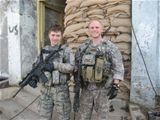An exhibit photo shows Senior Airmen Michael Malarsie (left) and Bradley Smith, who deployed together to Afghanistan in December 2009 as a 2-man TACP team from the 10th Air Support Operations Squadron embedded with an Army infantry company. Both were inju