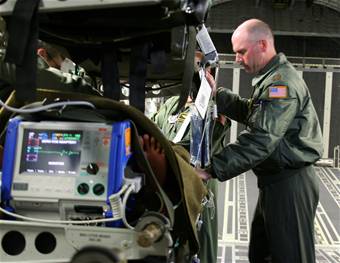 Flight surgeon monitors patient