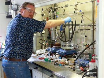 Dr. Rusty Blanski turns off a reaction in his lab. He and Nobel Laureate Dr. Robert Grubbs collaborated to develop a new technology that could reduce erosion in metallic rocket components, reduce production costs, and open the door for the use of new, en